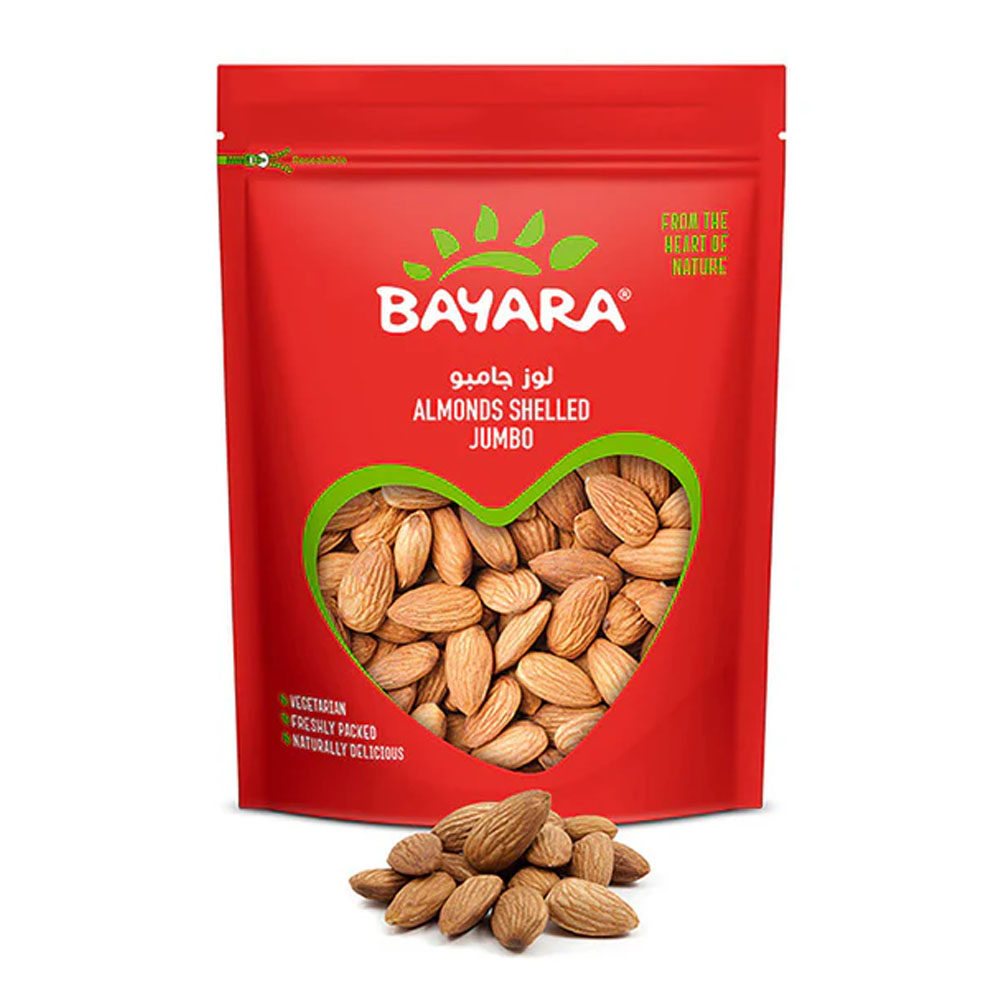 Almonds Shelled Jumbo 1Kg A red 1kg resealable bag of Bayara Jumbo Shelled Almonds with a heart-shaped window showing large brown whole almonds.