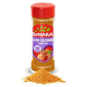 A 100ml shaker of Bayara Cajun Seasoning with a red lid and a purple label showing a grilled chicken drumstick.