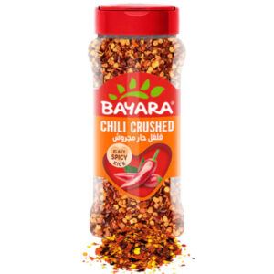 A 100g (330ml) shaker bottle of Bayara Chili Crushed showing bright red chili flakes and whole red peppers on the label.