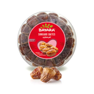 A 500g round clear container of Bayara Sukkary Dates showing soft, golden premium dates.