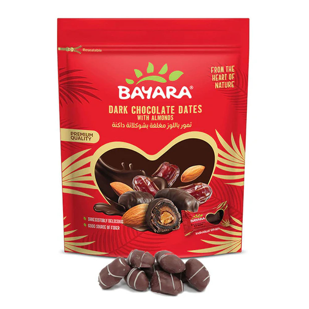 Dates With Almonds & Dark Chocolate 90g A 90g red resealable pack of Bayara Dark Chocolate Dates with Almonds showing the treats through a heart-shaped window.