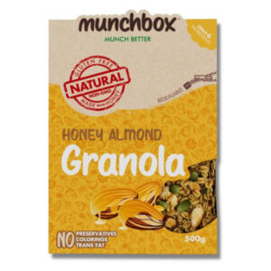 A yellow 500g resealable bag of Munchbox Honey Almond Granola showing crunchy clusters and almonds.