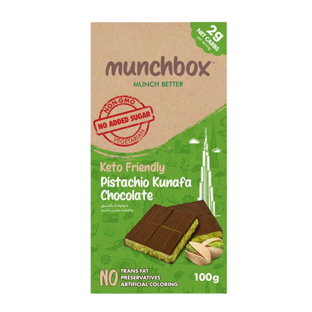 Keto Friendly Pistachio Kunafa Chocolate No Added sugar 100g A 100g Munchbox Keto Friendly Pistachio Kunafa Chocolate bar showing a green pistachio filling and "No Added Sugar" seal.