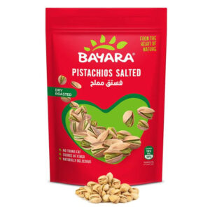 A 150g red resealable bag of Bayara Pistachios Salted showing whole roasted nuts through a heart-shaped window.
