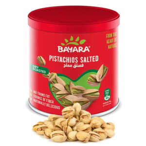 A 100g red can of Bayara Salted Pistachios showing open-shell nuts and "Dry Roasted" highlights.