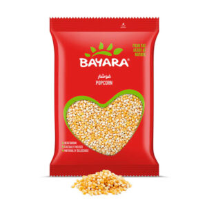 A 1kg red pack of Bayara Popcorn showing golden kernels through a heart-shaped window.