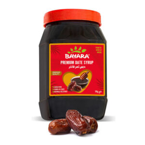 A large 1kg jar of Bayara Premium Date Syrup with a red lid and a label featuring fresh dates and a honey dipper.