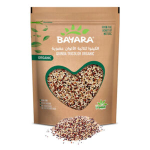 A 300g brown resealable bag of Bayara Organic Tricolor Quinoa showing white, red, and black grains through a heart-shaped window.