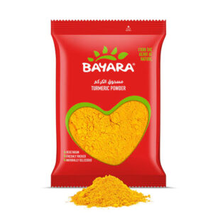A 500g red pouch of Bayara Turmeric Powder showing bright golden-yellow powder through a heart-shaped window.
