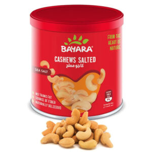 A 100g red can of Bayara Cashews Salted showing premium sea salted nuts and "Heart of Nature" branding.