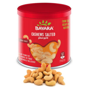 A 225g red can of Bayara Cashews Salted showing golden roasted cashews through a heart-shaped window.