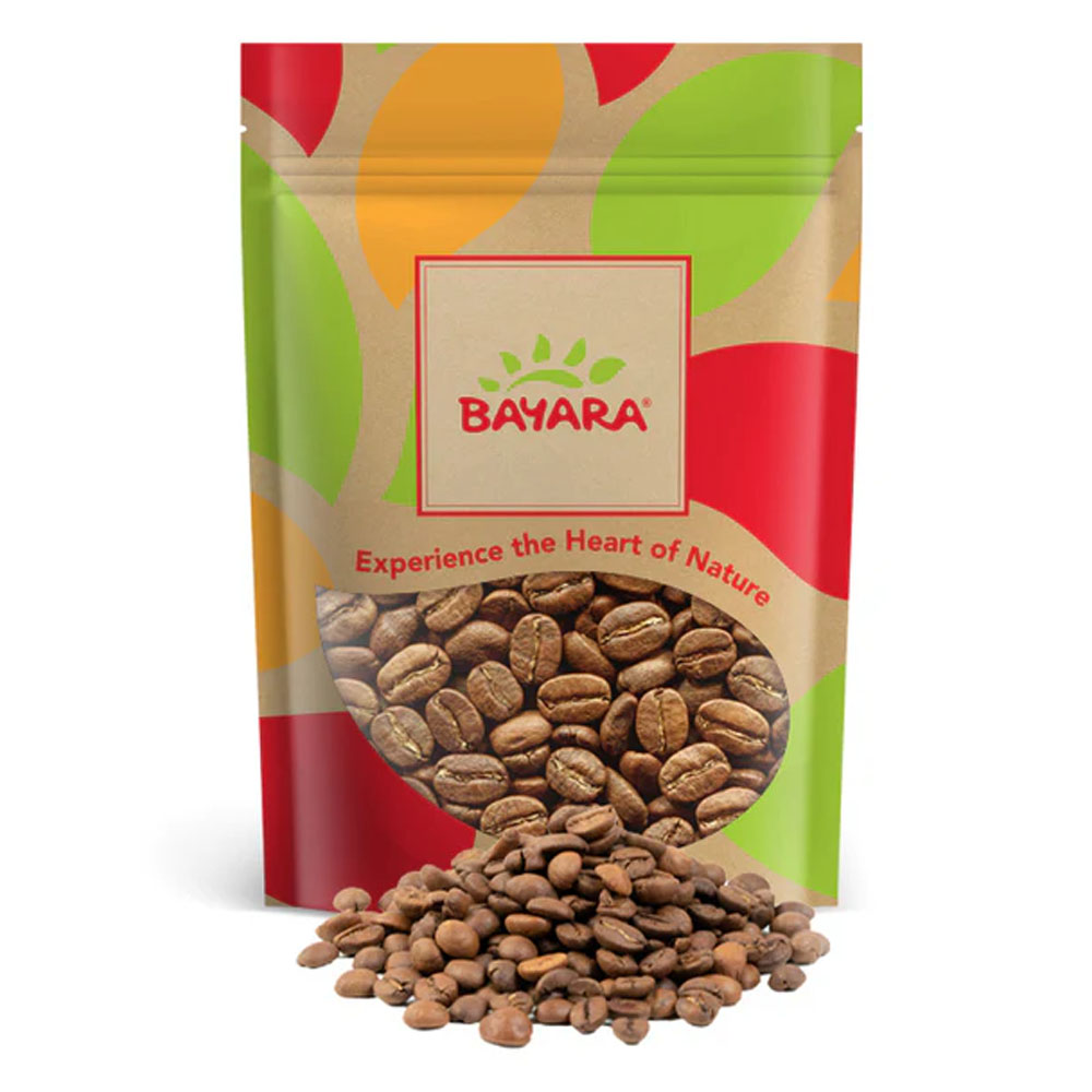 Colombiano Filter Coffee Medium 1kg A 1kg bag of Bayara Colombiano Filter Coffee Medium whole beans with a pile of roasted coffee beans in front.