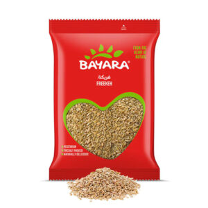 A 1kg red pouch of Bayara Freekeh with a heart-shaped window showing roasted green wheat grains.