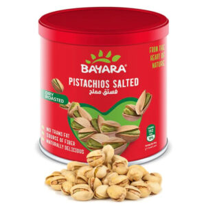 A 200g red can of Bayara Pistachios Salted showing dry roasted nuts and "Heart of Nature" branding.