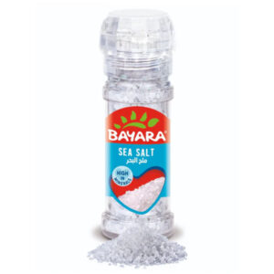 A 100ml clear bottle of Bayara Sea Salt Grinder showing coarse white salt crystals and the "High in Minerals" label.